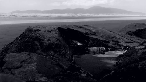 Scenic view of beach in front of mountains