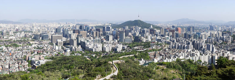 High angle view of modern buildings in city against sky