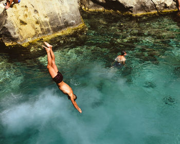 High angle view of man diving into sea