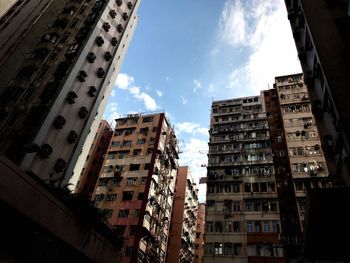 Low angle view of buildings in city against sky