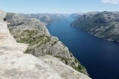 High angle view of sea and mountains against clear sky