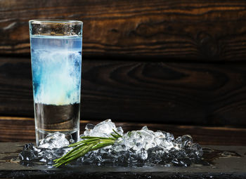 Close-up of cocktail on slate at restaurant