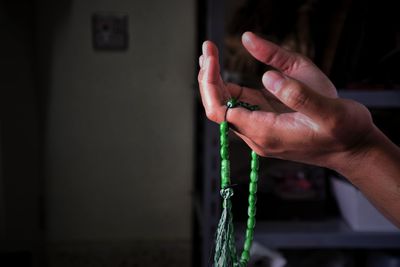 Close-up of hand holding hands at home