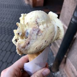 Close-up of hand holding ice cream cone