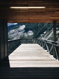 Wooden footbridge against sky