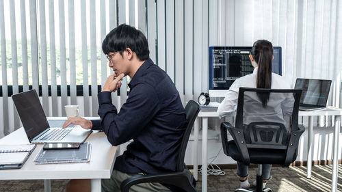 Businesswoman working at desk in office