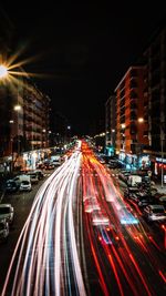 High angle view of light trails on city street at night