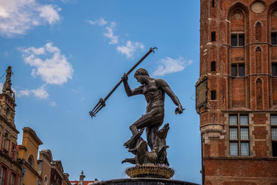 Low angle view of statue against sky