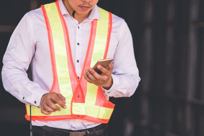 Low angle view of man working at night