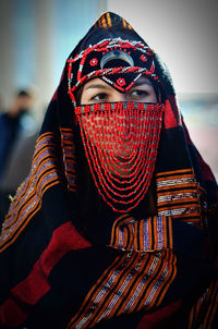 Young woman wearing traditional clothing outdoors