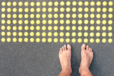 Low section of man standing on floor