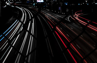 High angle view of light trails on highway at night