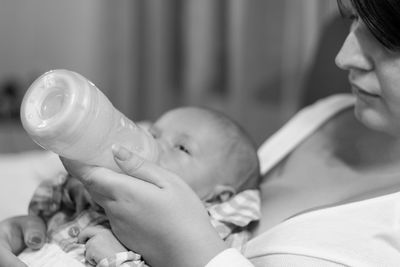 Close-up of baby holding hands