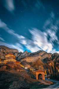 Scenic view of mountain against sky at night