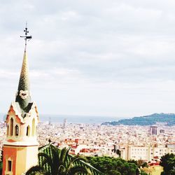 View of buildings against cloudy sky