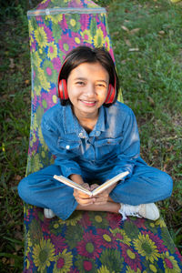 Smiling teenage girl on hammock