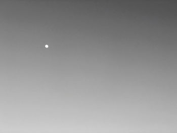 Low angle view of moon against sky at night