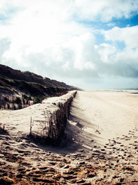 Scenic view of beach against sky