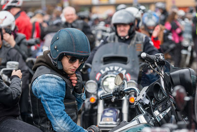 People working on motorcycle