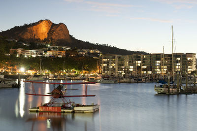 Biplane with boats in marina at dusk, townsville, queensland, australia