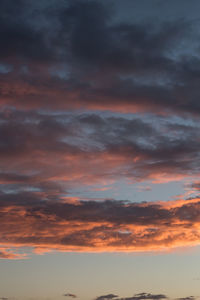 Low angle view of dramatic sky during sunset