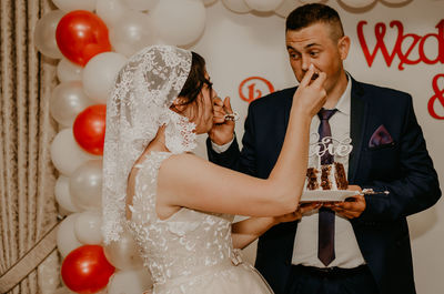 Portrait of smiling couple holding hands