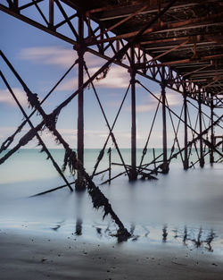 Bridge over sea against sky