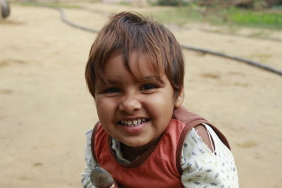 Portrait of cute smiling girl outdoors