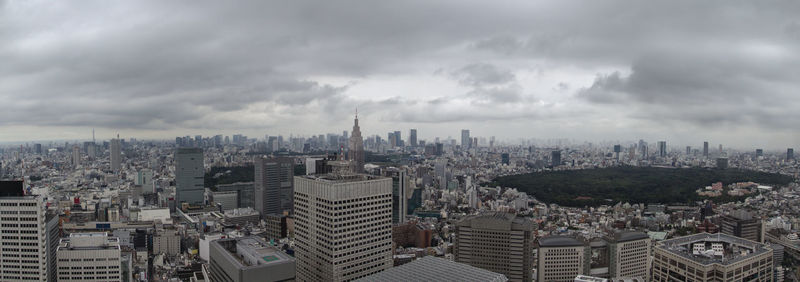 High angle view of cityscape against cloudy sky