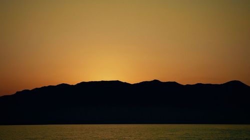 Scenic view of mountains at sunset