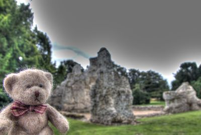 Teddy bear amongst religious ruins 