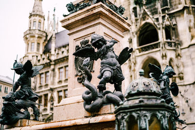 Low angle view of statue of historic building