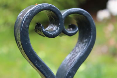 Close-up of water drop on metal