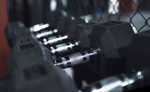 Close-up of dumbbells on rack