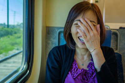 Young woman sitting in train