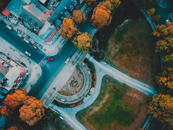 High angle view of street amidst trees in city