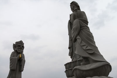 Low angle view of statue against sky