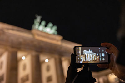 Low angle view of man using mobile phone