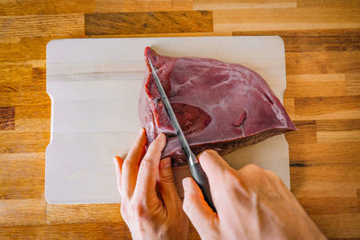 Cropped hand of person holding paper