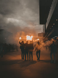 People on street in city at night