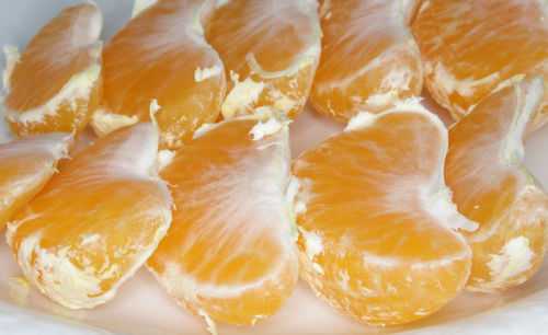 Peeled tangerina slices close-up