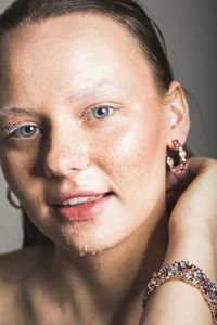 Close-up portrait of a smiling young woman