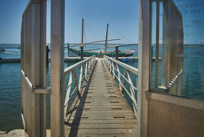 Pier over sea against sky