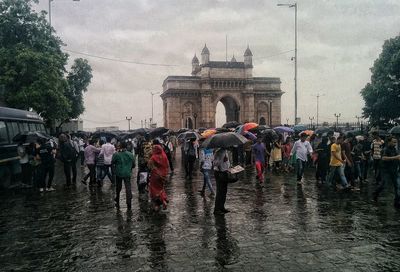 People at town square against sky