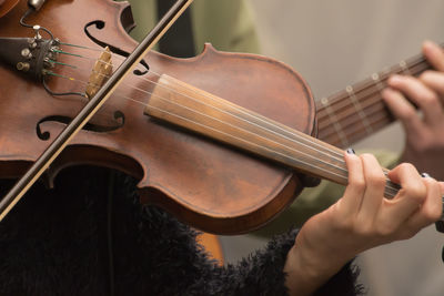 Midsection of musicians performing on street