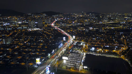 High angle view of illuminated city street at night