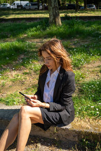 Young woman using mobile phone