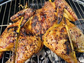 High angle view of meat on barbecue grill