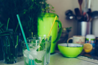 Close-up of wine glasses on table