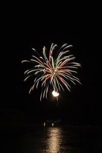 Firework display at night